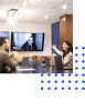 Two people in an office setting having a remote meeting